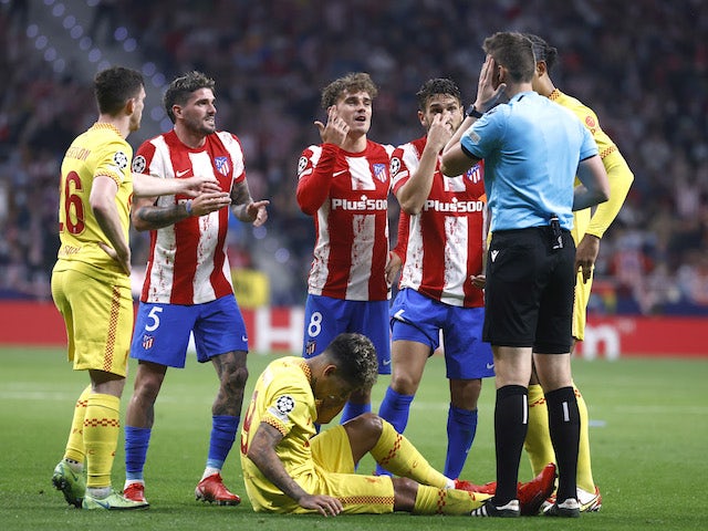 Atletico Madrid's Antoine Griezmann remonstrates with referee Daniel Siebert before being shown a red card on October 19, 2021