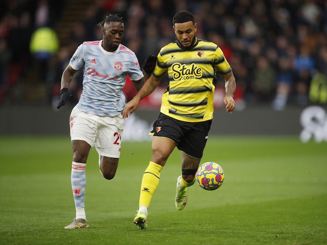 Manchester United's Aaron Wan-Bissaka in action with Watford's Joshua King in November 2021