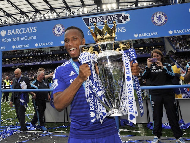 Didier Drogba celebrates after winning the Premier League title with Chelsea in 2014-15