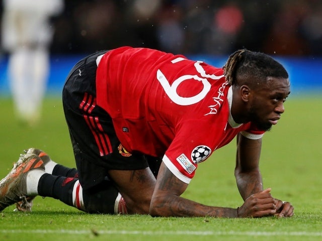 Manchester United's Aaron Wan-Bissaka reacts after sustaining an injury, November 8, 2021