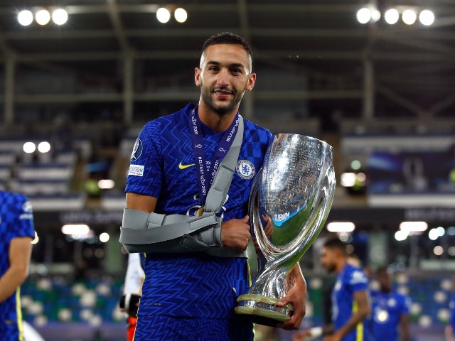 An injured Hakim Ziyech celebrates after Chelsea win the UEFA Super Cup on August 11, 2021