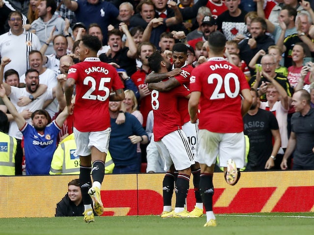 Manchester United's Marcus Rashford celebrates scoring their second goal with Bruno Fernandes and teammates on September 4, 2022
