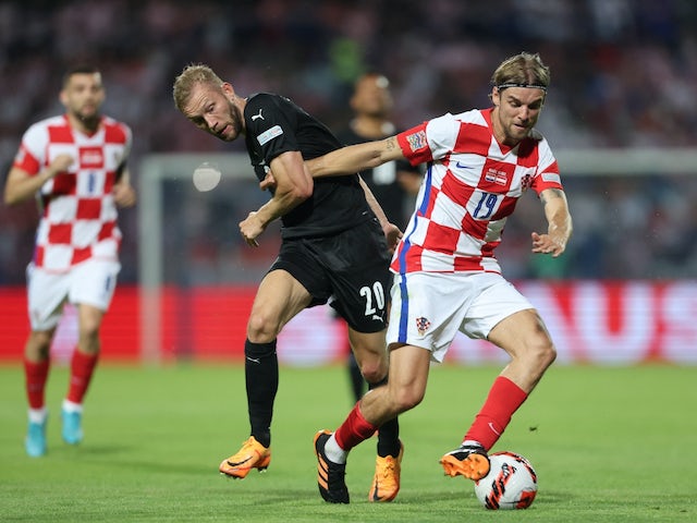 Croatia's Borna Sosa in action with Austria's Konrad Laimer on June 3, 2022