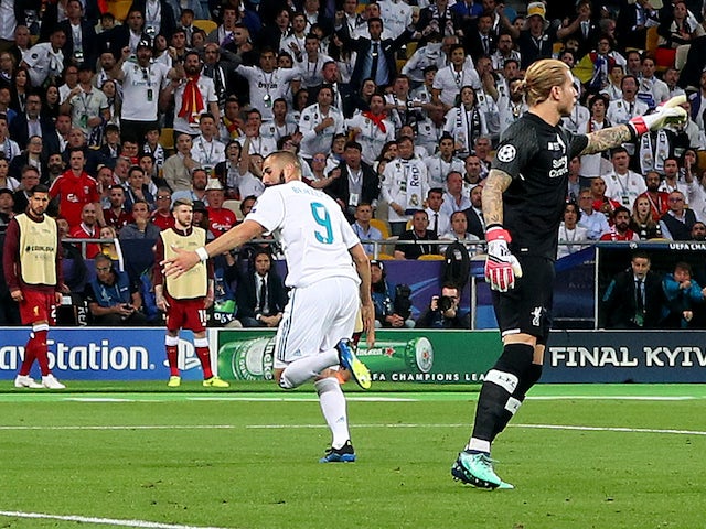 Real Madrid's Karim Benzema celebrates scoring against Liverpool's Loris Karius on May 26, 2018