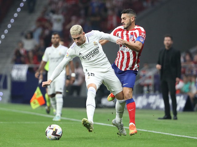 Real Madrid's Federico Valverde in action with Atletico Madrid's Koke on September 18, 2022