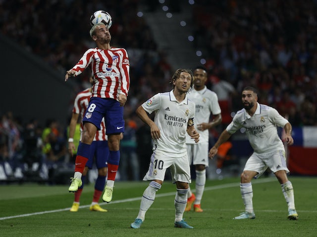 Atletico Madrid's Antoine Griezmann in action with Real Madrid's Luka Modric on September 18, 2022
