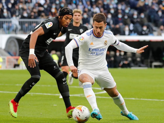 Real Madrid's Eden Hazard in action with Elche's Johan Mojica on January 22, 2022