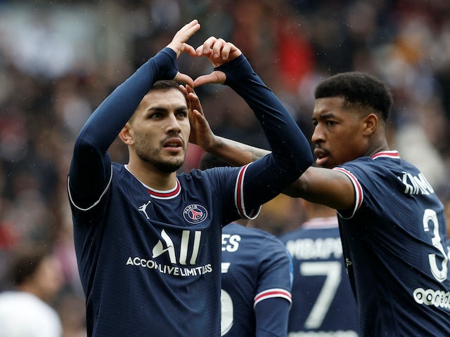 Paris Saint-Germain's Leandro Paredes celebrates scoring their third goal with Presnel Kimpembe on March 13, 2022