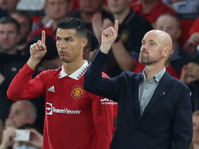 Manchester United's Cristiano Ronaldo with manager Erik ten Hag before coming on as a substitute on August 22, 2022