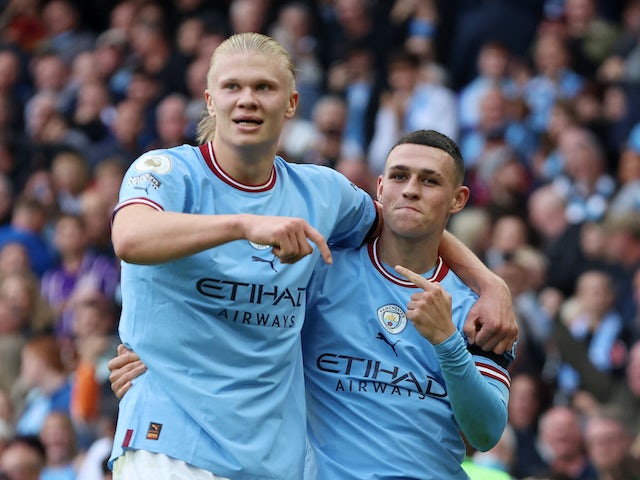 Manchester City's Phil Foden celebrates scoring their sixth goal with Erling Braut Haaland and completing his hat-trick on October 2, 2022
