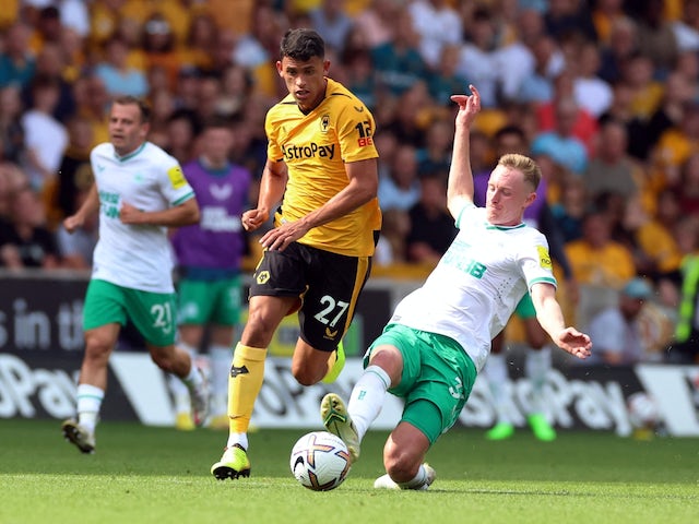 Wolverhampton Wanderers' Matheus Nunes in action with Newcastle United's Sean Longstaff on August 28, 2022