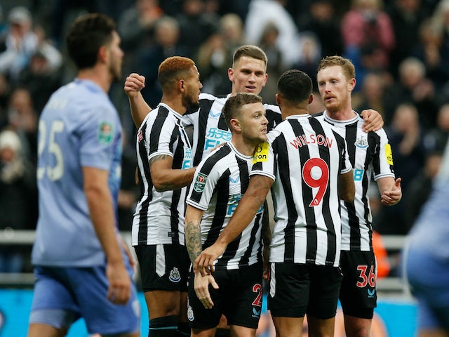 Newcastle United's Kieran Trippier and teammates celebrate after AFC Bournemouth's Adam Smith scores an own goal on December 20, 2022