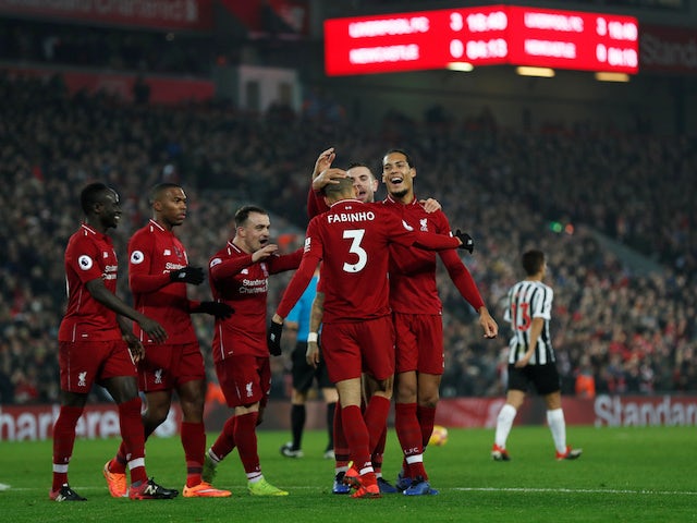 Liverpool players celebrate after Fabinho's goal during their win over Newcastle United on December 26, 2018